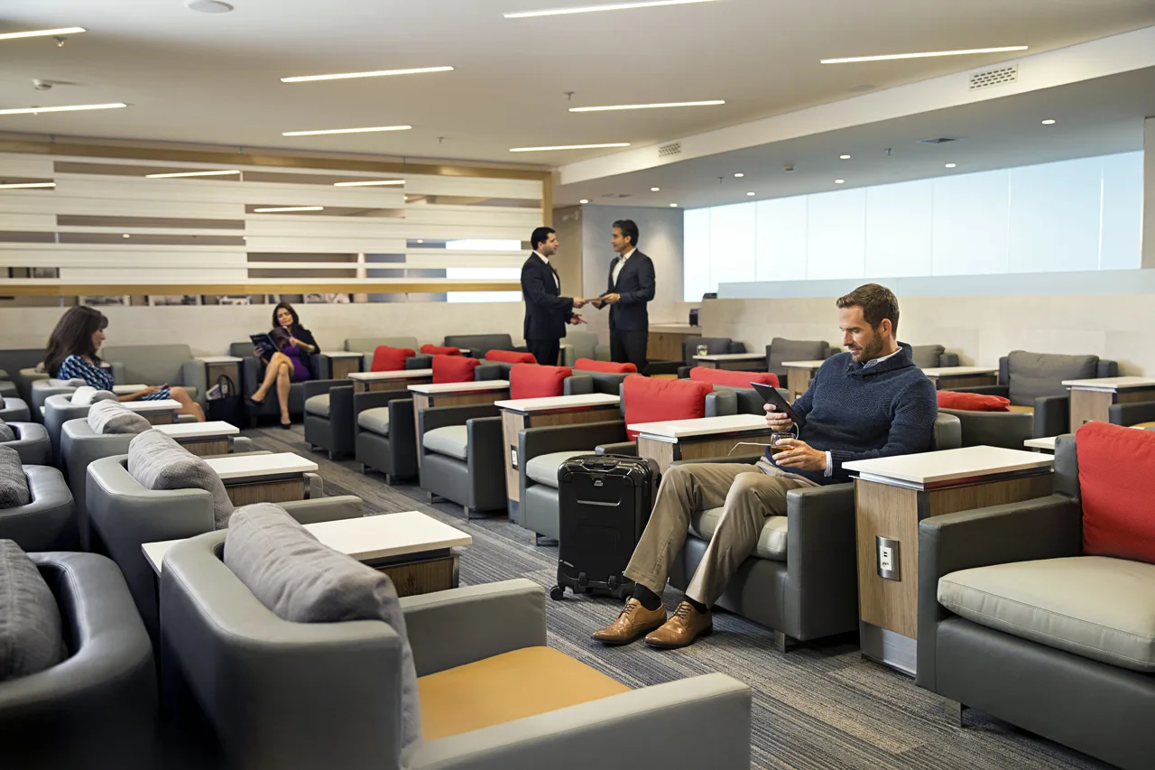Admirals Club seating area, the kind of lounge access typically unlocked by a successful airline status match.