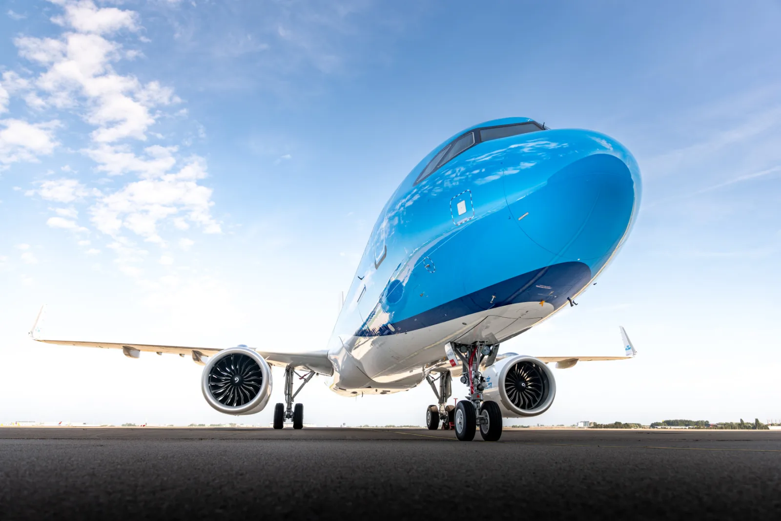 KLM Airbus A321neo in flight, illustrating the moving redemption targets that make a devaluation-defence plan necessary.