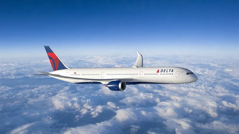 Aircraft wing view against blue sky during flight