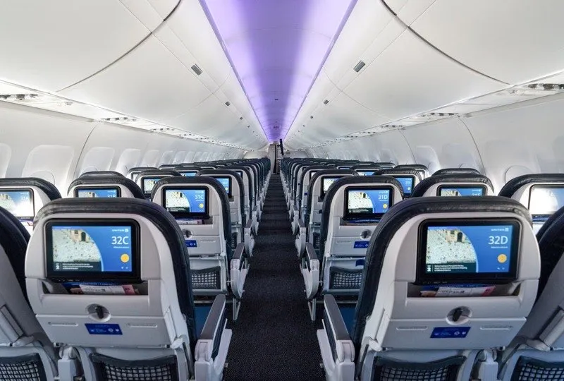 Modern aircraft cabin interior with contemporary design and amenities